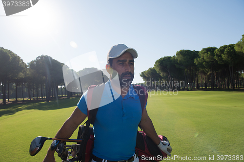 Image of golf player walking