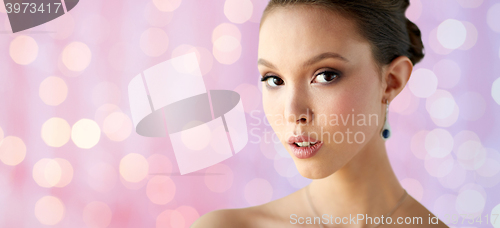 Image of close up of beautiful woman face with earring