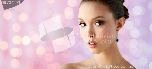 Image of close up of beautiful woman face with earring