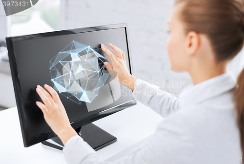 Image of businesswoman with projection on computer