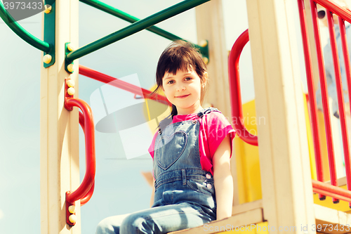 Image of happy little girl on children playground