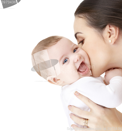 Image of mother kissing adorable baby