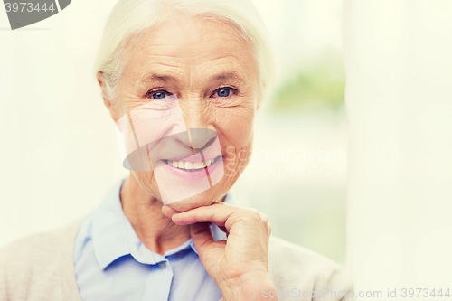 Image of happy senior woman face at home