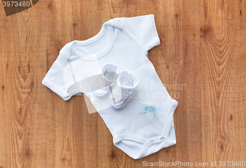 Image of close up of baby boys clothes for newborn on table