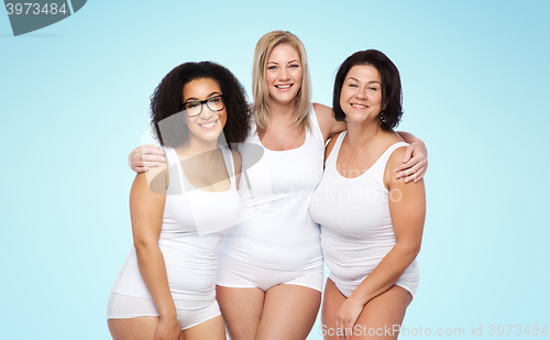 Image of group of happy plus size women in white underwear