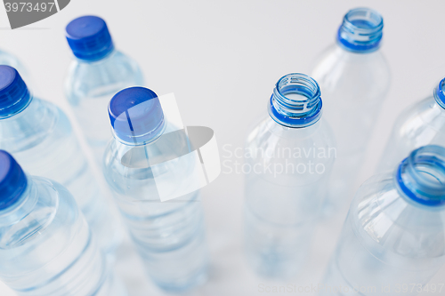 Image of close up of bottles with drinking water on table