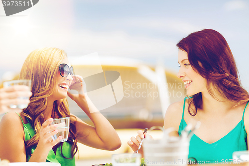 Image of girls in cafe on the beach