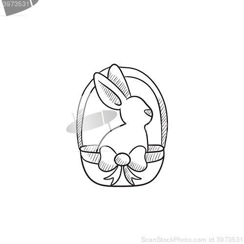 Image of Easter bunny sitting in basket sketch icon.