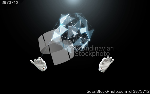 Image of magician hands with magic wand showing trick