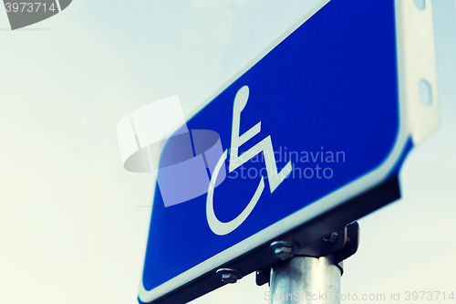 Image of close up of road sign for disabled outdoors