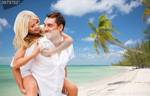 Image of happy couple having fun over summer beach