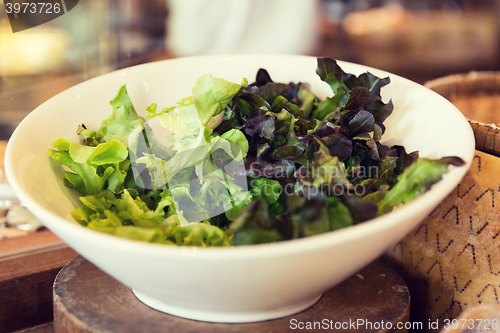 Image of bowl of green salad lettuce at asian restaurant