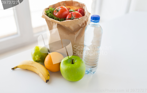 Image of basket of vegetable food and water at kitchen