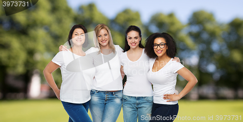 Image of group of happy different women in white t-shirts