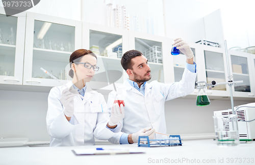 Image of young scientists making test or research in lab