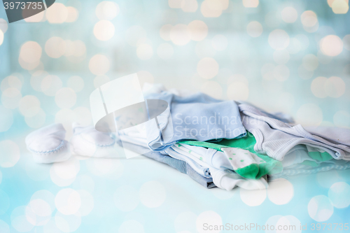 Image of close up of baby boys clothes for newborn on table