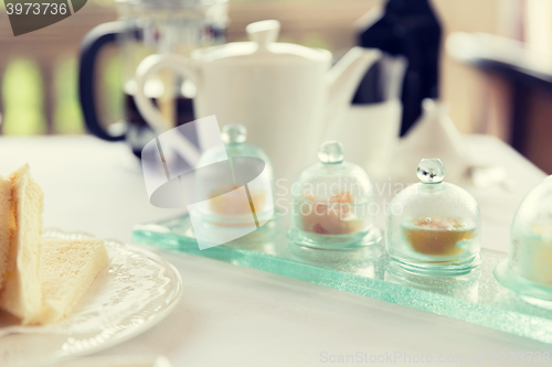 Image of close up of tea time set with jam on table
