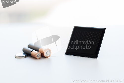 Image of close up of alkaline batteries and solar cell