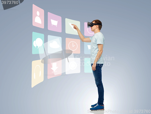 Image of happy man in virtual reality headset or 3d glasses