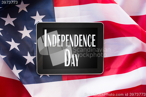 Image of close up of tablet pc on american independence day