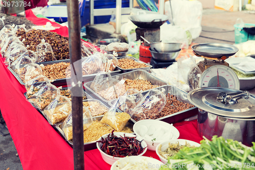 Image of nuts and spices sale at asian street market