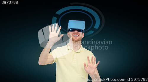 Image of happy man in virtual reality headset or 3d glasses