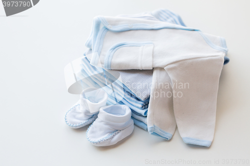 Image of close up of baby boys clothes for newborn on table