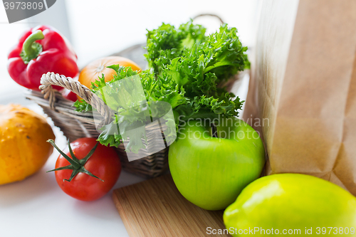 Image of basket of fresh ripe vegetables at kitchen