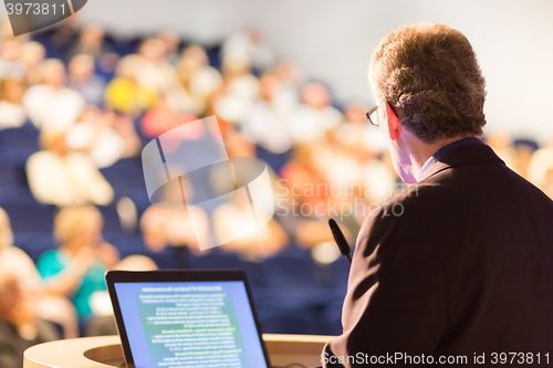 Image of Speaker at Business Conference and Presentation.