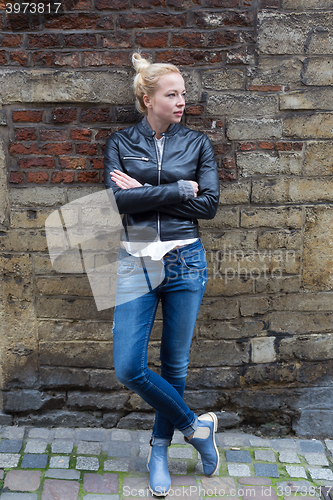 Image of Fashion street style portrait of young woman.