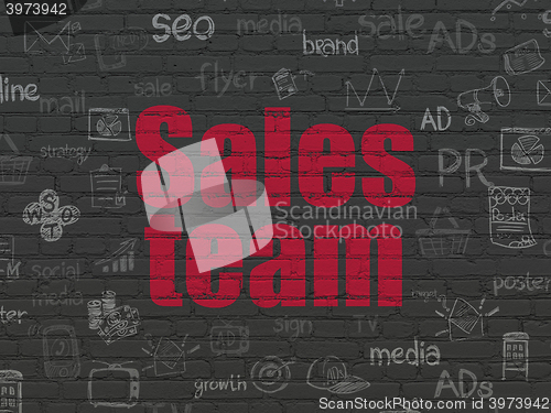 Image of Marketing concept: Sales Team on wall background