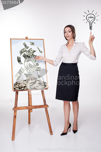 Image of The young business woman showing idea on the white background