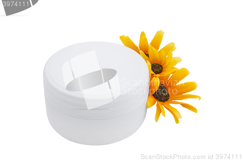 Image of Spa cosmetic cream and flowers isolated on white