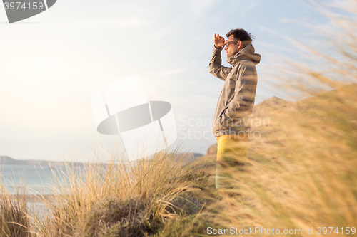 Image of Free active man enjoying beauty of nature.