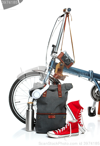 Image of The new modern bicycle and suitcase, sneakers, thermos