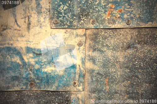 Image of Sheets of galvanized iron fastened by rivets