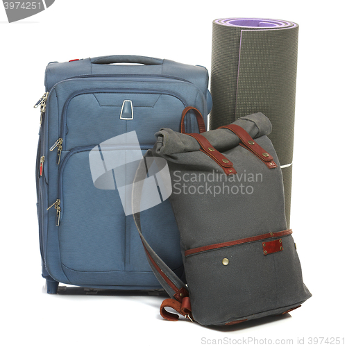 Image of The suitcases, karrimat on white background.