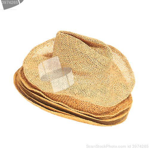 Image of The lot of straw hats isolated on white background.