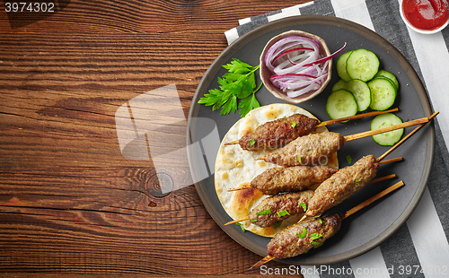 Image of grilled minced meat skewers kebabs