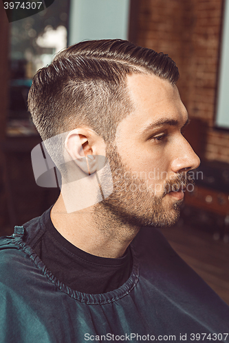 Image of The young man in barbershop