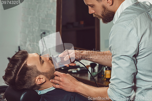 Image of Hipster client visiting barber shop