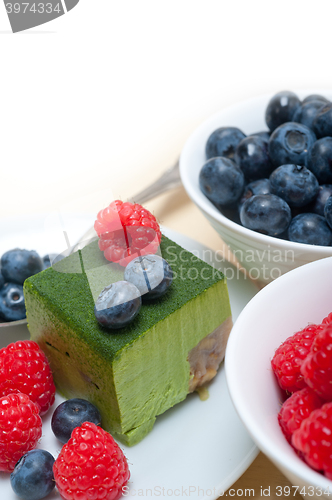 Image of green tea matcha mousse cake with berries