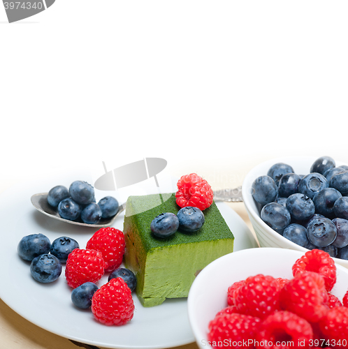 Image of green tea matcha mousse cake with berries