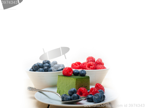 Image of green tea matcha mousse cake with berries