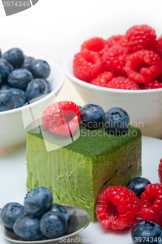 Image of green tea matcha mousse cake with berries