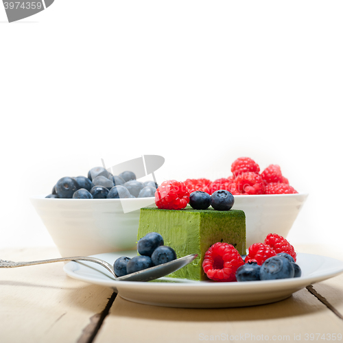 Image of green tea matcha mousse cake with berries