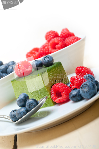 Image of green tea matcha mousse cake with berries