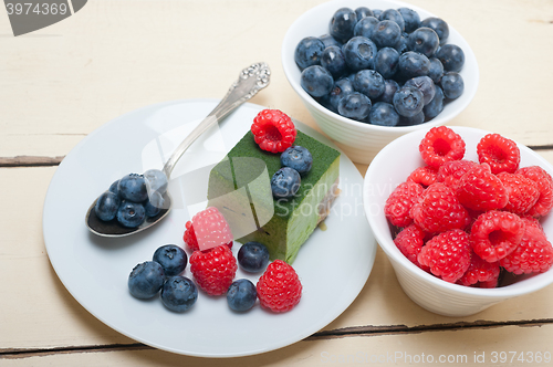 Image of green tea matcha mousse cake with berries