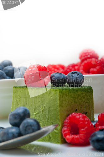 Image of green tea matcha mousse cake with berries