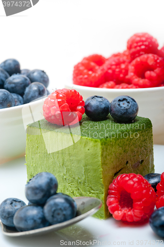 Image of green tea matcha mousse cake with berries